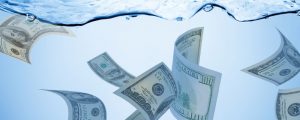 Money floating in water depicting value of water